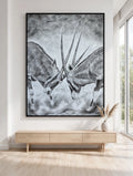 The Reckoning in a black floating frame, shown in a modern white room